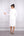 V Yaka Boncuk Detaylı Midi Boy Elbise Ekru